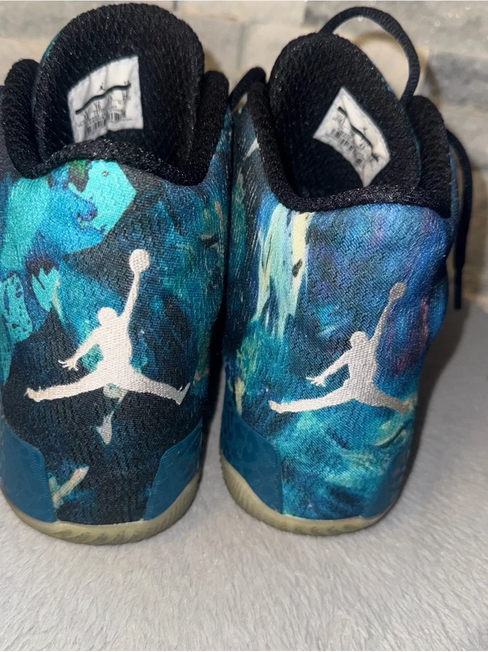 Jordan Men’s High-Top Athletic Shoes in Teal and Black Abstract Print